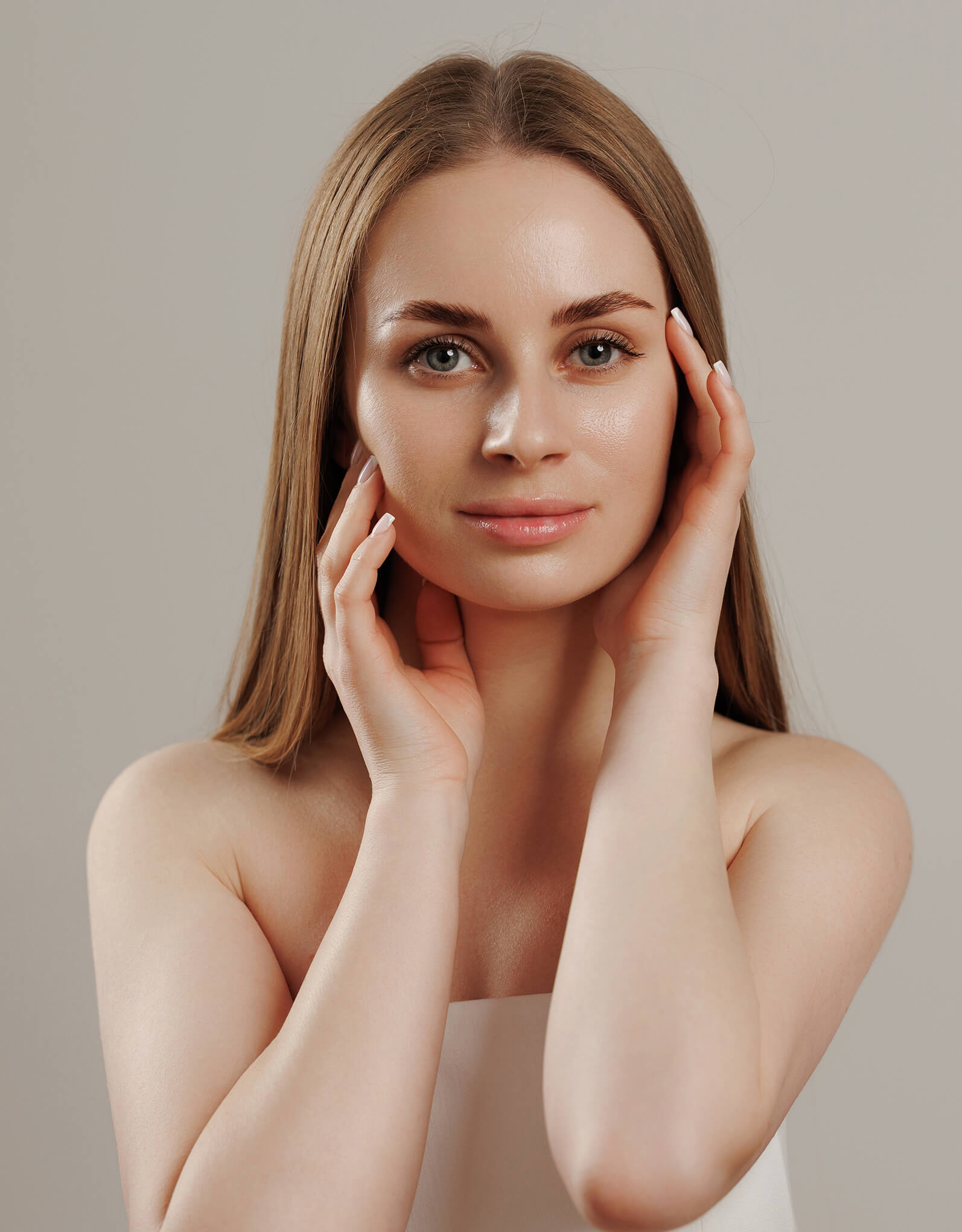woman touching her face